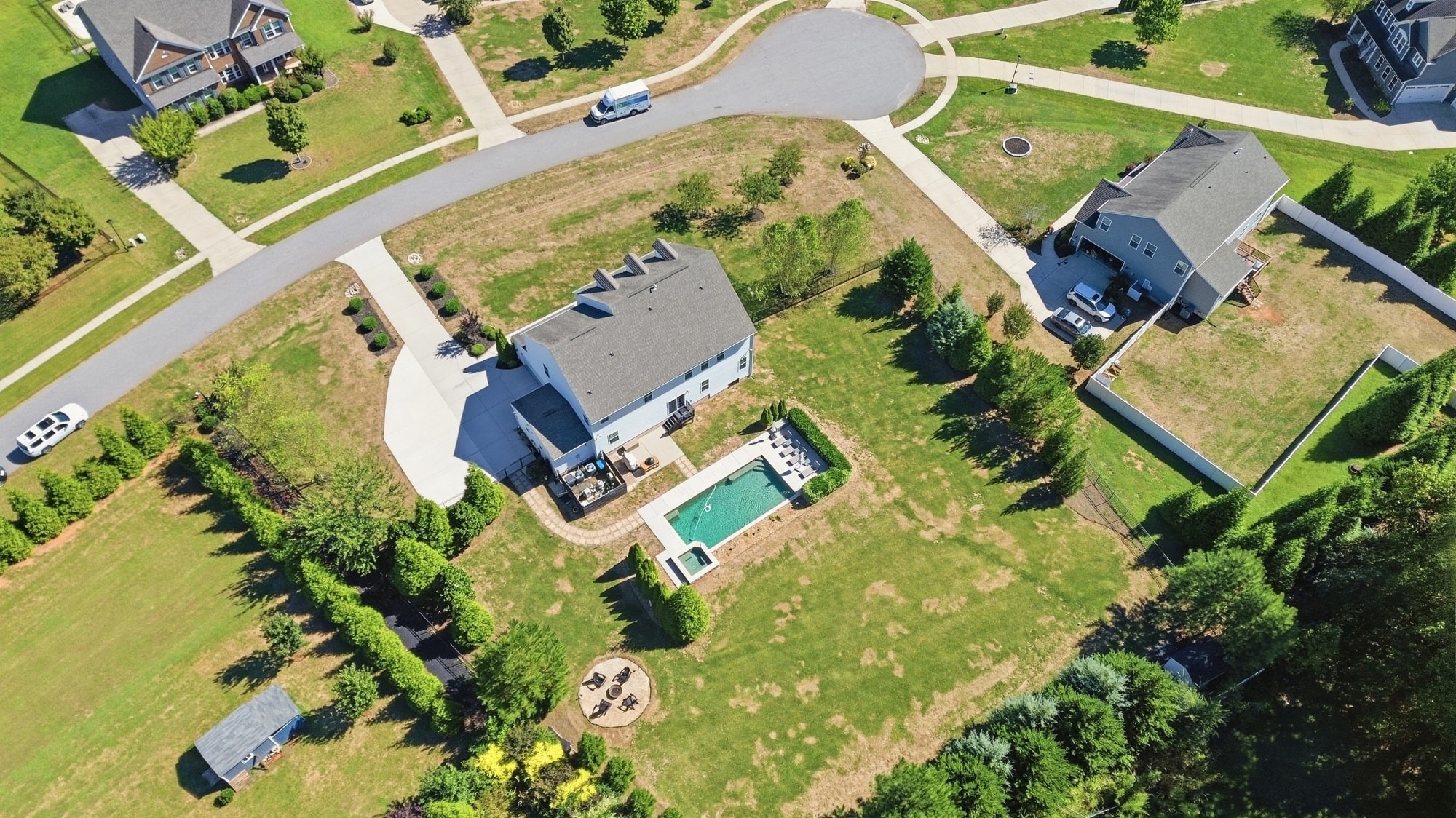 Aerial view of 912 Manorwood Drive showing the cul-de-sac setting, pool, fire pit, and full lot depth in Brookmeade, Waxhaw NC