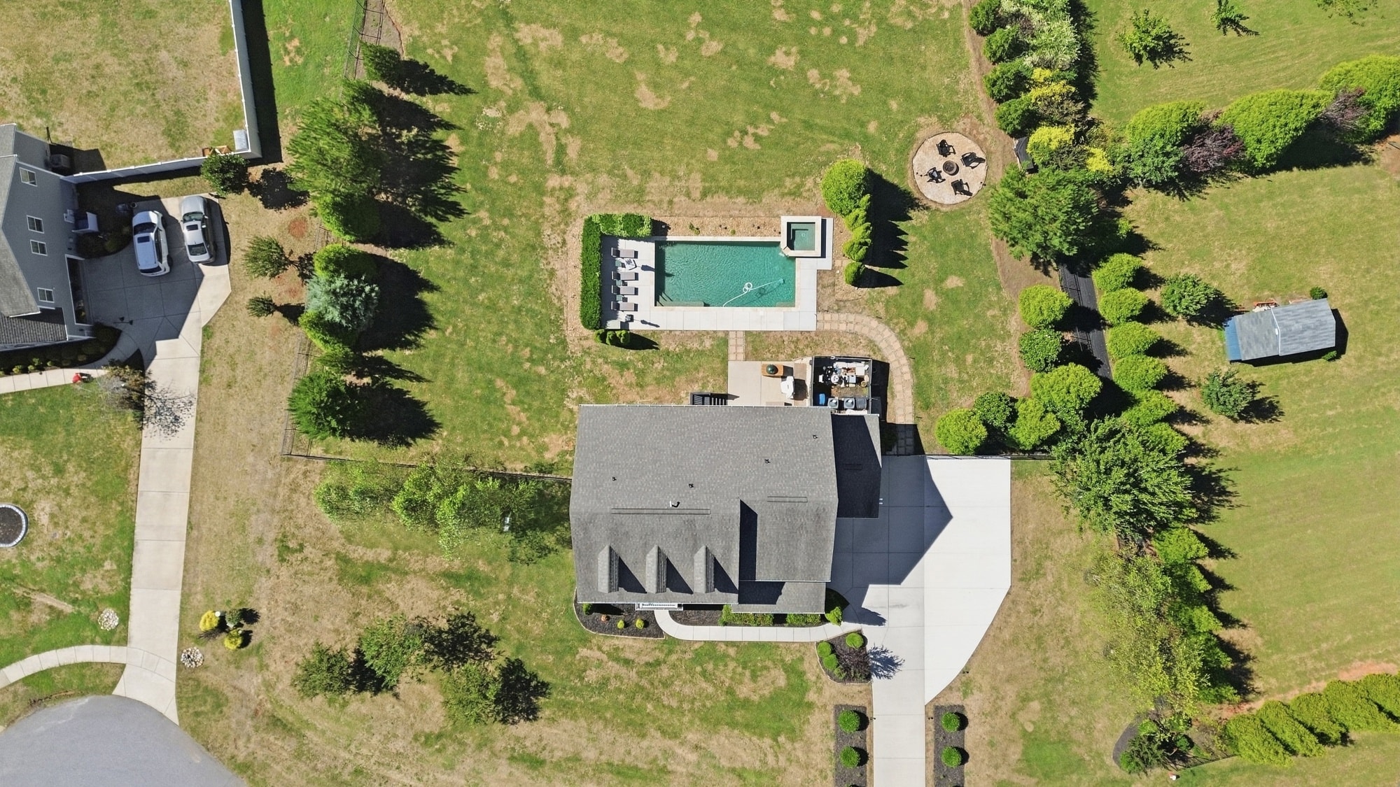 Aerial overhead view of 912 Manorwood Drive showing the pool, fire pit, shed, and full lot at 912 Manorwood Drive, Waxhaw NC
