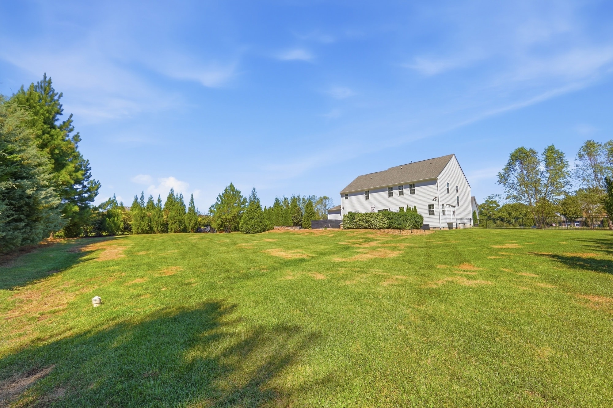 Wide view of the open lawn and rear of the home at 912 Manorwood Drive, Waxhaw NC